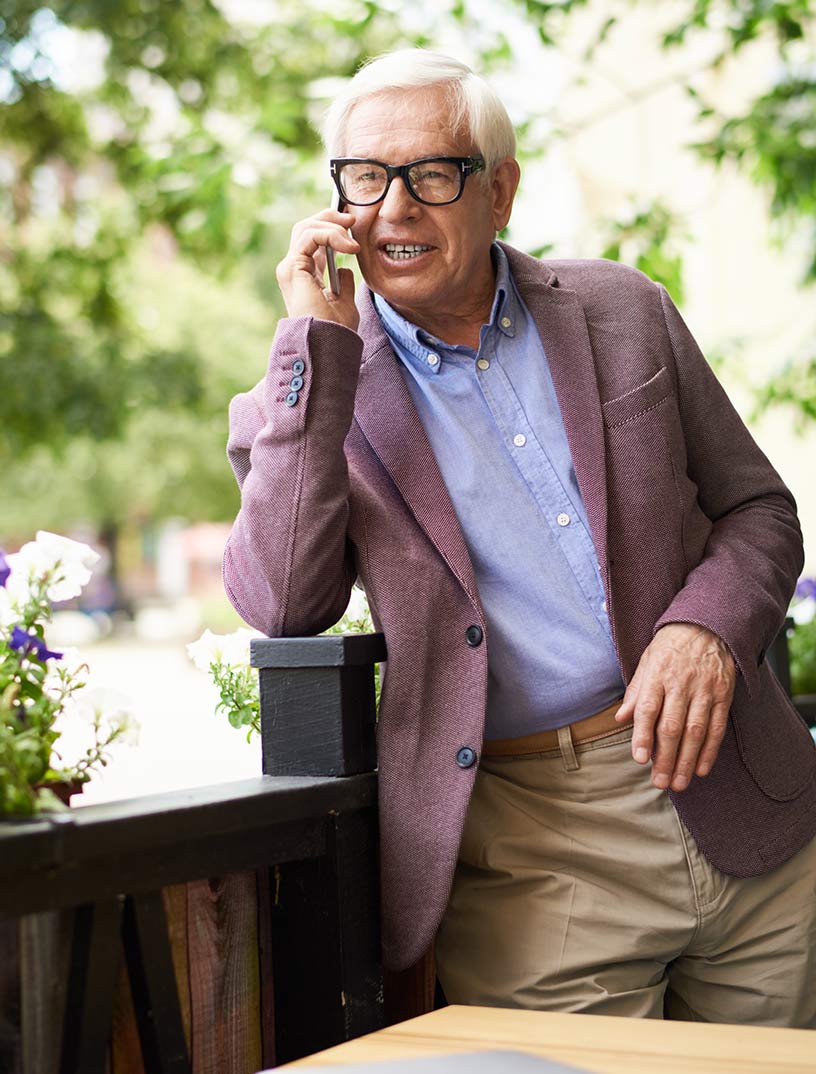 senior man on phone with financial advisor discussing medicare plans columbs oh.jpg