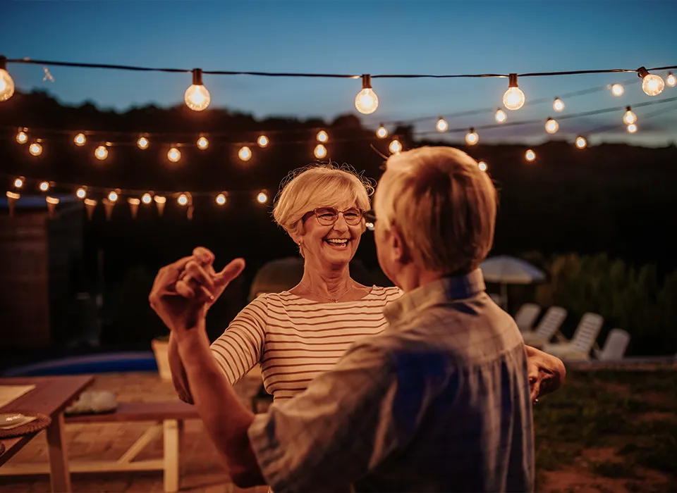 retirees dancing on outdoor patio retirement