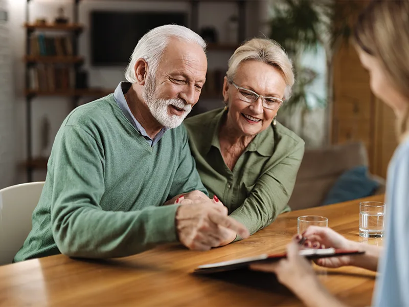 retirees meeting with financial and wealth advisor to discuss roth conversions