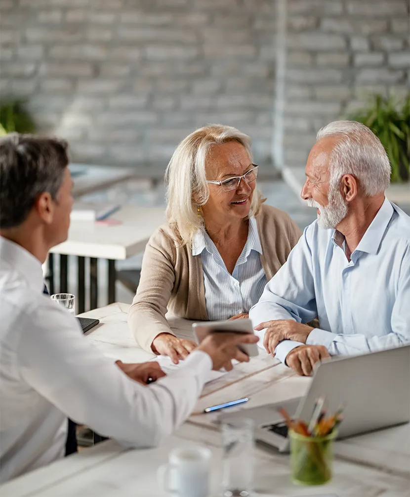 retirees meeting with wealth financial advisor